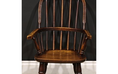 A 19th century beech, ash and elm child’s Windsor elbow chai...