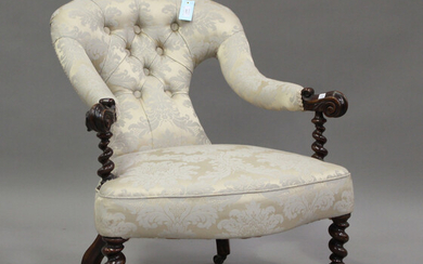 A 19th century mahogany framed scroll armchair, upholstered in blue damask, on barley twist legs, he