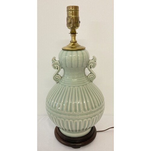 A 2 handled celadon glazed ceramic lamp base of classical de...