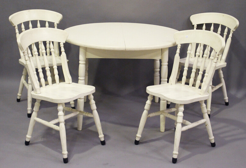 A 20th century white painted pine extending kitchen table, height 75cm, length 141cm, depth 106cm, a