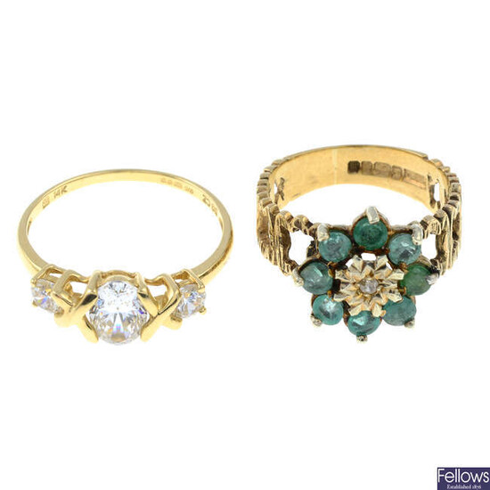 A 9ct gold emerald and diamond cluster ring and a 14ct gold cubic zirconia three stone ring.
