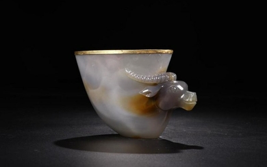 A AGATE VESSEL WITH GOLD OUTLINE