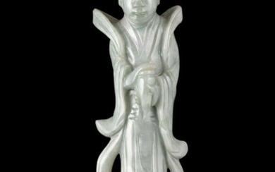 A APPLE GREEN ACCENT MILKY JADEITE CARVING OF...
