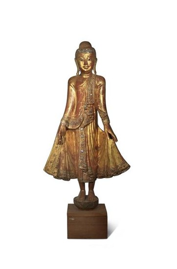 A BURMESE MANDALAY-STYLE LACQUERED AND GILT-WOOD FIGURE OF...