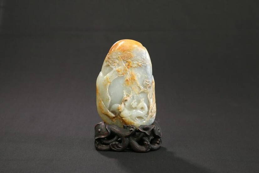 A CHINESE PALE CELADON JADE BOULDER CARVING, carved to
