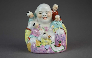 A Chinese porcelain figure of Buddha, 20th Century