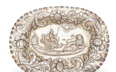 A Continental repousse silver dish, possibly Sicilian, 18th century, stamped ROF and 17 3/4, together with an additional mark and tremolierstrich to reverse, the field designed with lion-drawn chariot scene to a sunflower and scroll surround and...
