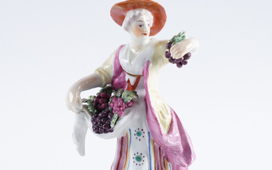 A DERBY FIGURE OF A WOMAN SELLING FRUIT