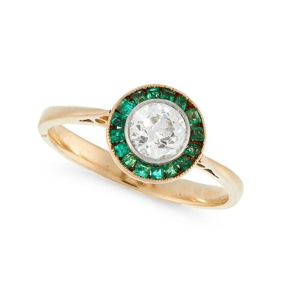 A DIAMOND AND EMERALD DRESS RING in high carat yellow