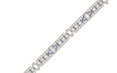 A DIAMOND AND SAPPHIRE BRACELET in platinum and white gold, the openwork bracelet set throughout