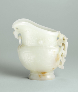 A FINELY CARVED AND VERY RARE WHITE JADE ARCHAISTIC EWER, QIANLONG PERIOD (1736-1795)