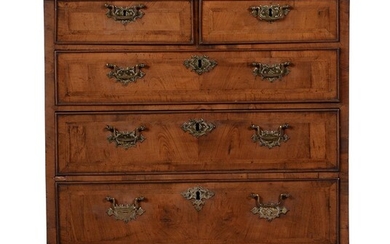 A GEORGE II WALNUT AND FEATHER BANDED BACHELOR'S CHEST OF DRAWERS, CIRCA 1740