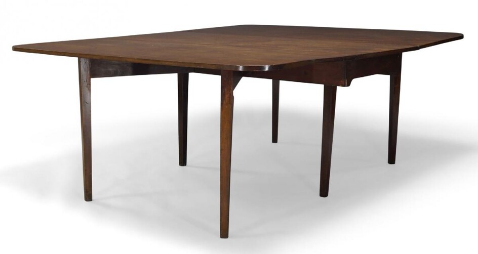 A George III mahogany dining table, the rounded rectangular top...