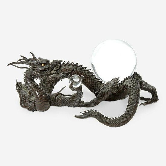 A Japanese patinated bronze dragon and rock crystal