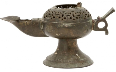 A Khorasan openwork oil lamp, Iran, 12th century, on trumpet...