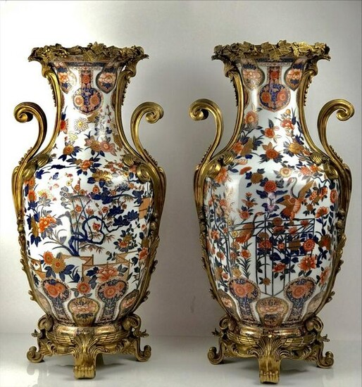 A LARGE PAIR OF ORMOLU MOUNTED PORCELAIN VASES