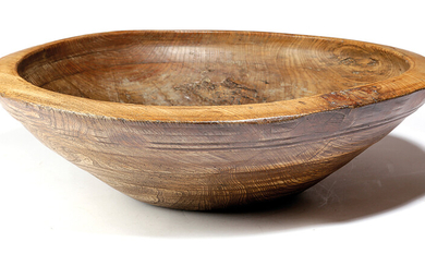 A LARGE TREEN ELM TURNED DAIRY BOWL