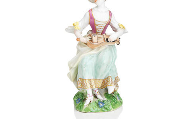 A Meissen figure of a lady playing the hurdy-gurdy