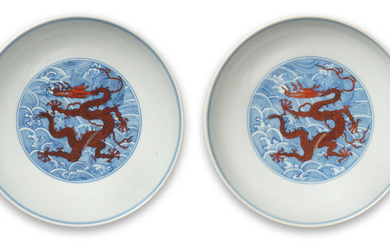 A RARE PAIR OF BLUE AND WHITE IRON-RED ENAMELLED 'DRAGON'...