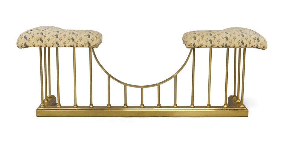 A Regency style brass club fender, 20th century, stud bound upholstery, with stepped base, 48cm high, 132cm wide, 36cm deep