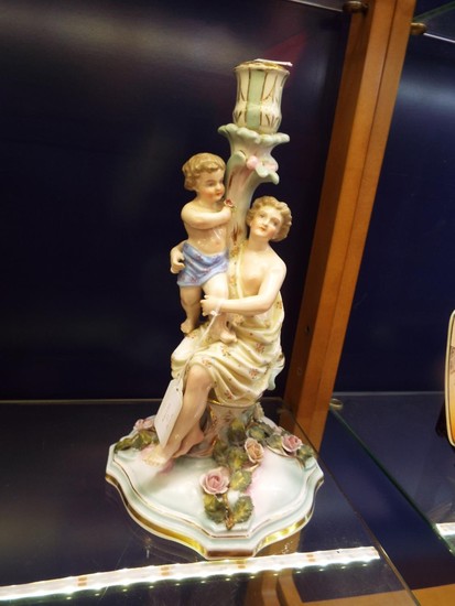 A Sitenzdorf porcelain figure of a mother and child seated w...