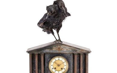 A TWO HEADED CROW RAISED ON A VICTORIAN BLACK SLATE MANTEL CLOCK