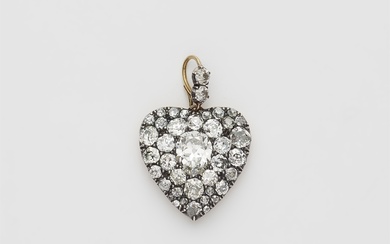 A Victorian silver 18k gold and diamond heart locket.