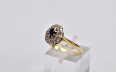A YELLOW METAL SAPPHIRE AND DIAMOND CLUSTER RING, designed...