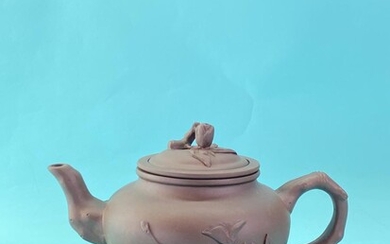 A “YiXing” 宜兴 报春 teapot decorated with peach branches...