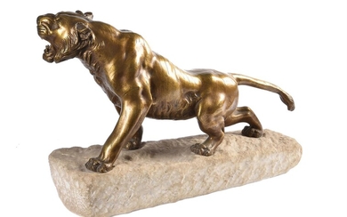 A bronze model of a tiger on a stone base