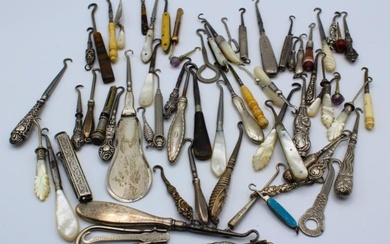 A collection of sixty-three Victorian and later button hooks, including...