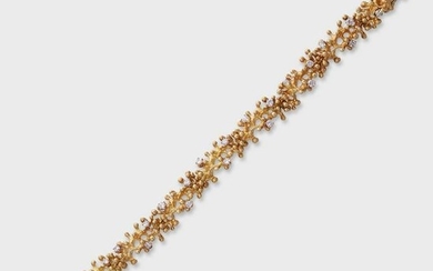 A diamond and eighteen karat gold strap bracelet, Ed