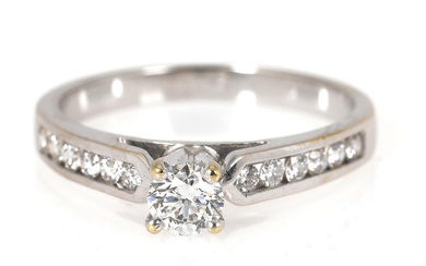 A diamond ring set with numerous brilliant-cut diamonds, mounted in 14k white...