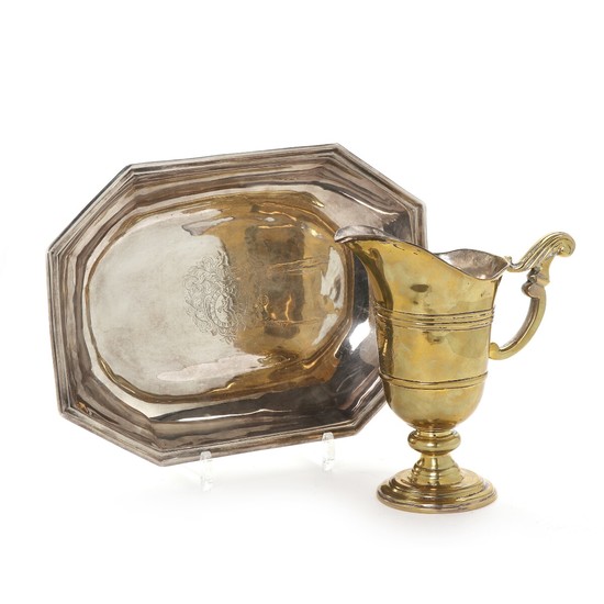 A first half 18th century Norwegian Baroque silvered brass jug and dish bearing the crest of the Roklinges. (2)