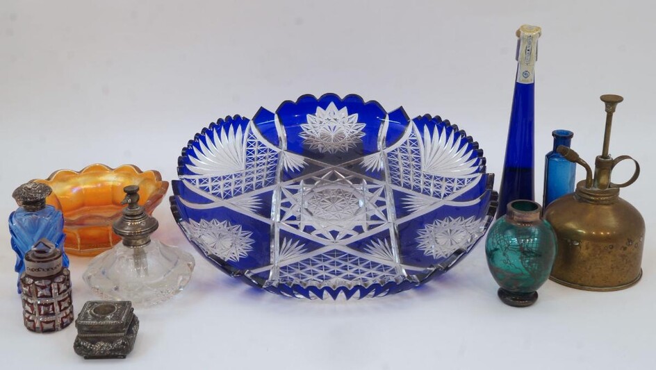 A group of glassware, comprising: a Bohemian cobalt cut glass dish, 29cm diameter; a small iridescent glass dish with scalloped edge; five scent bottles; an atomiser; a heart shaped marginal mirror, 61cm high; and a brass oval table mirror with...