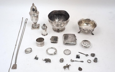 A group of silver, comprising: a footed bowl, Birmingham, 1908, maker's mark rubbed, dia. 13cm; a sugar caster, stamped Britannia and Lion head erased, 1901, possibly Maurice Freeman, 17cm high; a Victorian repousse decorated sugar bowl, London...