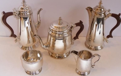 A heavy five-piece hallmarked silver tea and coffee service...