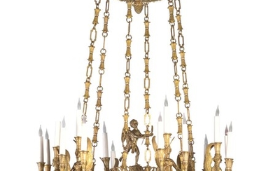 A large Empire style gilt bronze chandelier. 20th century. H. 130 cm. Diam. 90 cm.