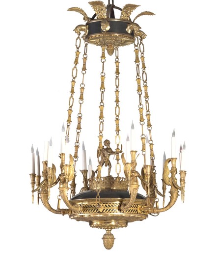 A large Empire style gilt bronze chandelier. 20th century. H. 130 cm. Diam. 90 cm.
