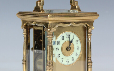 A late 19th century French lacquered brass cased carriage clock with eight day movement striking hou