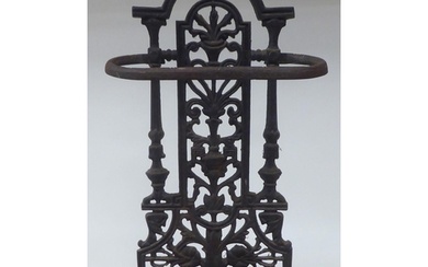 A late Victorian cast iron stickstand, the pierced upstand d...