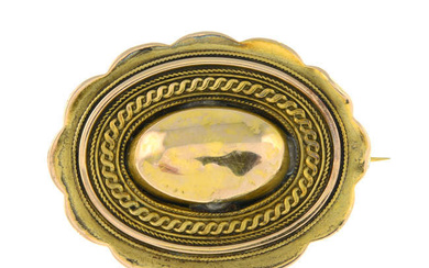 A late Victorian gold scalloped brooch, with glazed panel reverse.