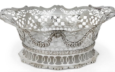 A late Victorian silver cake basket, London, 1899, Daniel & John Wellby, of shaped oval form, the pierced sides decorated with applied floral garlands to laurel wreath band above pierced shaped oval foot, 31cm long, 13.4cm high, approx. weight 38.5oz