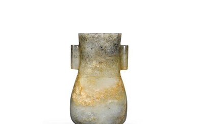 A motted celadon and grey jade baluster vase with tubular handles Yuan/Ming dynasty | 元/明 灰青玉貫耳瓶