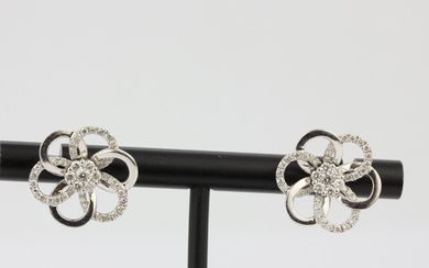 A pair of 18ct white gold flower shaped stud earrings set with brilliant cut diamonds, L. 1.6cm.