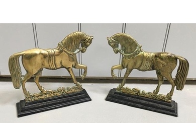 A pair of 19th century, cast brass door stops. Each formed a...