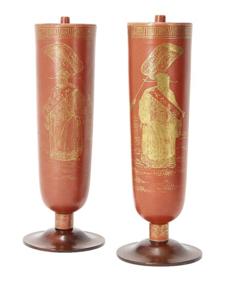 A pair of Chinese porcelain coral-glazed incense holders, Qianlong period, of slightly tapering cylindrical form, the exteriors painted in gilt enamel with scholars reading hand scrolls whilst boy attendants fan them, with two lines of...