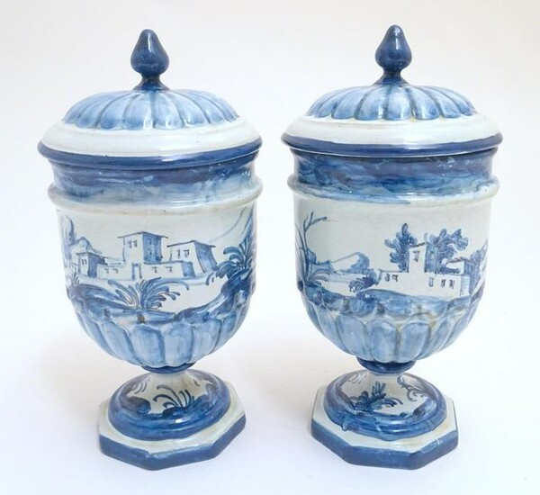 A pair of Continental blue and white pedestal jars and