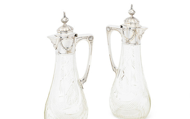 A pair of Russian silver-mounted claret jugs