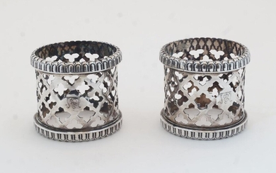 A pair of Victorian pierced napkin rings, with pierced quatrefoil decoration and gadrooned rims, Birmingham, 1859, George Unite, 4.2cm high, 4.8cm dia., total weight approx. 3.1oz